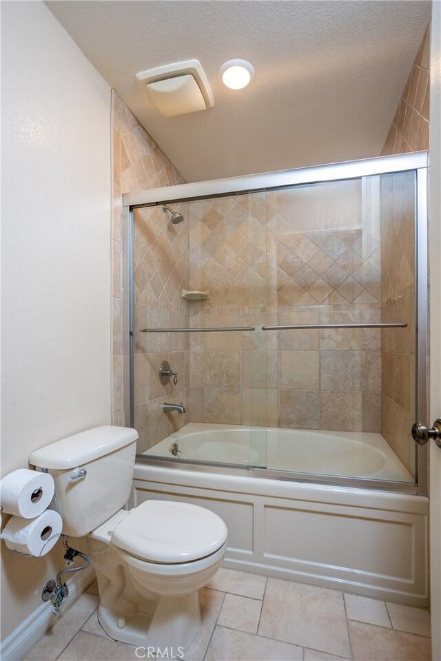 3192 Lytle Creek Rd, Lytle Creek, CA 92358 - full bath featuring toilet, tile patterned floors, and shower / bath combination with glass door