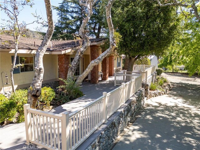 3192 Lytle Creek Rd, Lytle Creek, CA 92358 - view of front of home featuring stucco siding, brick siding, and a shingled roof