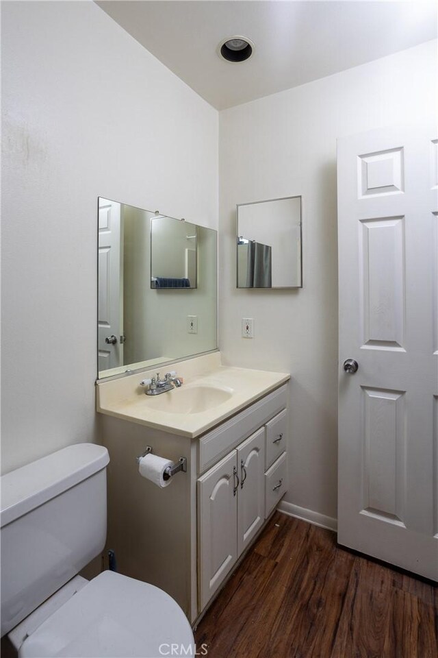 3192 Lytle Creek Rd, Lytle Creek, CA 92358 - bathroom with toilet, wood finished floors, and vanity
