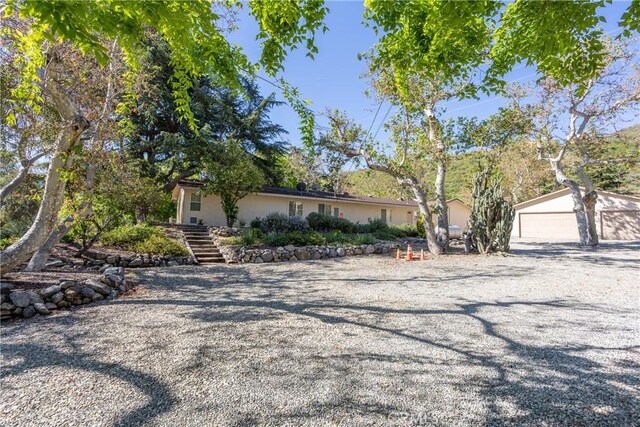3192 Lytle Creek Rd, Lytle Creek, CA 92358 - view of front of home featuring stairway, an outbuilding, and a garage