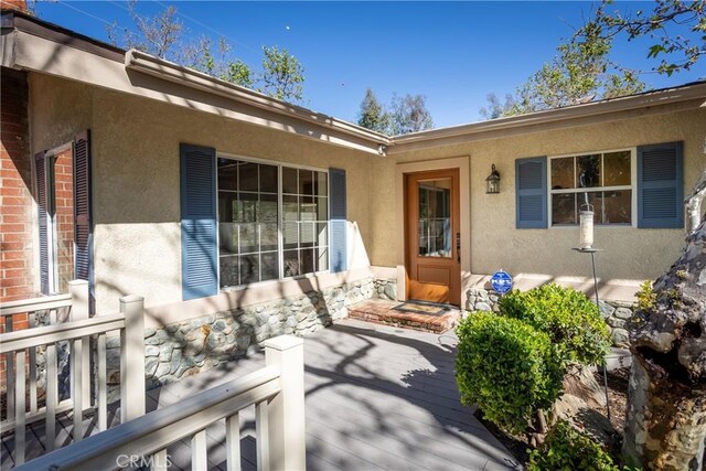 3192 Lytle Creek Rd, Lytle Creek, CA 92358 - view of exterior entry with stucco siding and stone siding