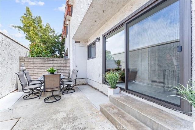 view of patio featuring outdoor dining area