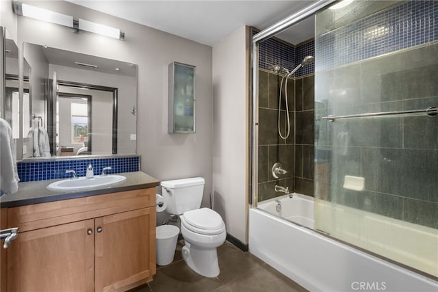 12842 Palm St Unit 301, Garden Grove, CA 92840 - full bath featuring vanity, bath / shower combo with glass door, tile patterned flooring, and decorative backsplash