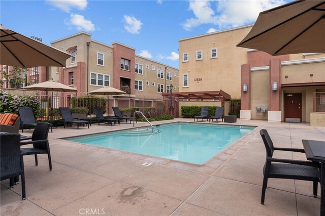 12842 Palm St Unit 301, Garden Grove, CA 92840 - pool with a pergola, a patio, and fence