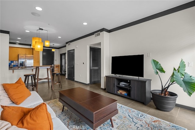 12842 Palm St Unit 301, Garden Grove, CA 92840 - living room with baseboards, crown molding, tile patterned floors, and recessed lighting