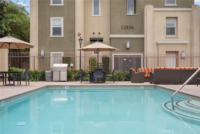 12842 Palm St Unit 301, Garden Grove, CA 92840 - community pool with area for grilling, an outdoor hangout area, and a patio area