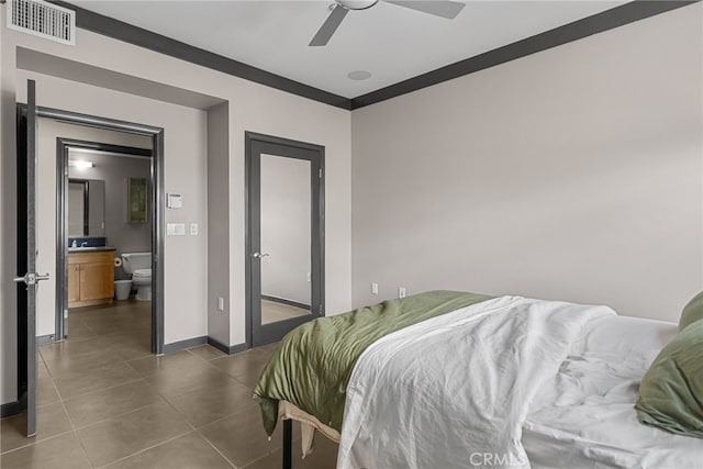 12842 Palm St Unit 301, Garden Grove, CA 92840 - bedroom with dark tile patterned floors and ceiling fan