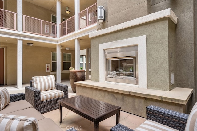 12842 Palm St Unit 301, Garden Grove, CA 92840 - patio / terrace featuring a patio and an outdoor living space with a fireplace