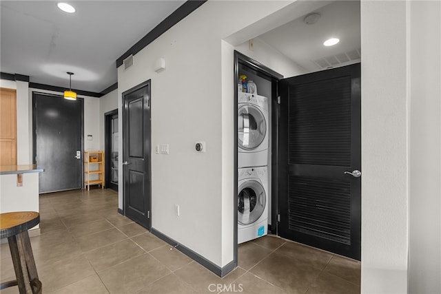 12842 Palm St Unit 301, Garden Grove, CA 92840 - laundry area featuring stacked washer / drying machine, tile patterned floors, and recessed lighting