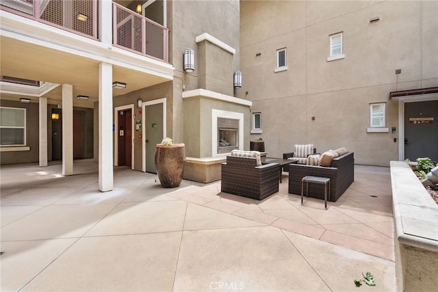 12842 Palm St Unit 301, Garden Grove, CA 92840 - patio / terrace with an outdoor living space with a fireplace and a patio