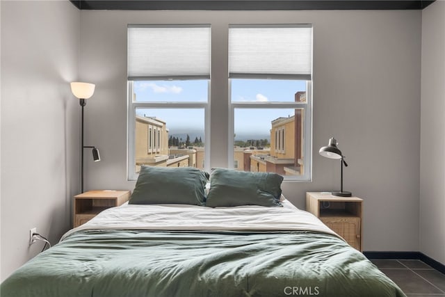 12842 Palm St Unit 301, Garden Grove, CA 92840 - bedroom featuring dark tile patterned floors and baseboards