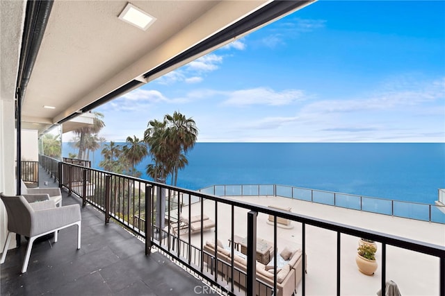 balcony featuring a water view