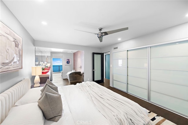 bedroom featuring visible vents, recessed lighting, wood finished floors, and ceiling fan