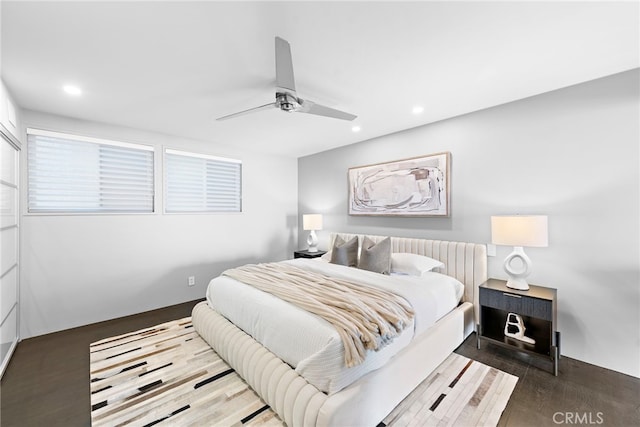 bedroom featuring wood finished floors, ceiling fan, and recessed lighting