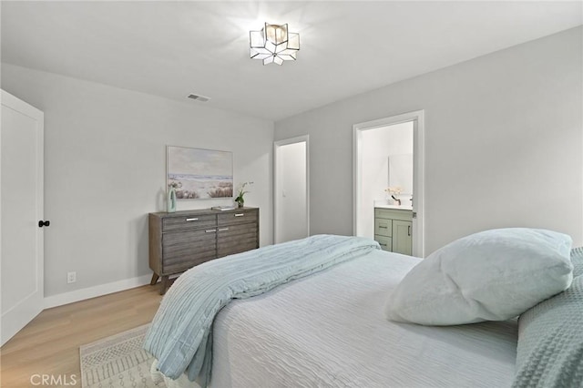 347 E Barkley Ave, Orange, CA 92867 - bedroom with visible vents, light wood-style flooring, baseboards, and connected bathroom