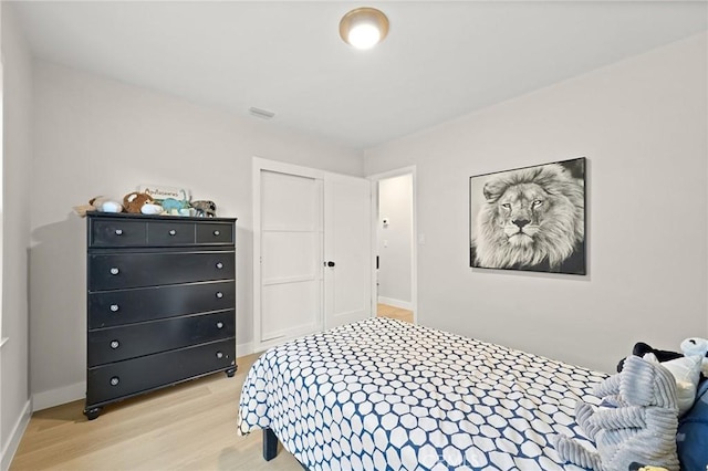 347 E Barkley Ave, Orange, CA 92867 - bedroom with light wood-style floors, a closet, and baseboards