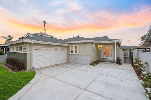 347 E Barkley Ave, Orange, CA 92867 - view of front facade featuring a gate, fence, stucco siding, concrete driveway, and a garage