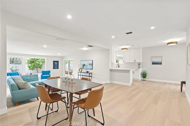 347 E Barkley Ave, Orange, CA 92867 - dining area featuring light wood-type flooring, baseboards, and recessed lighting