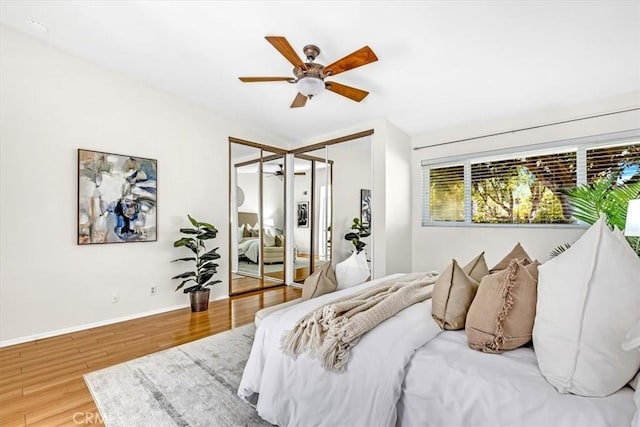 86 Sandpiper Unit 17, Irvine, CA 92604 - bedroom with wood finished floors, multiple closets, baseboards, and ceiling fan