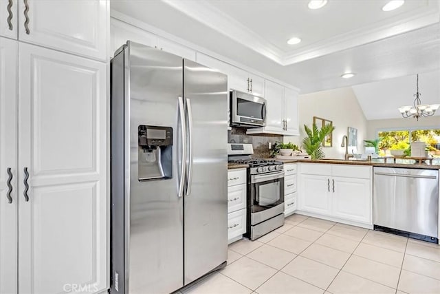 86 Sandpiper Unit 17, Irvine, CA 92604 - kitchen with white cabinets, backsplash, stainless steel appliances, and recessed lighting