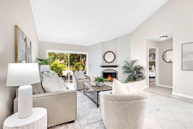 86 Sandpiper Unit 17, Irvine, CA 92604 - living area featuring vaulted ceiling, light tile patterned flooring, a brick fireplace, and baseboards