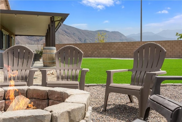 view of yard with a mountain view and a fenced backyard