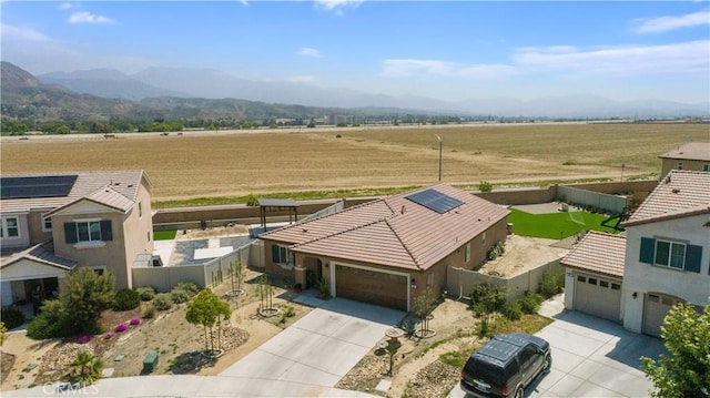 birds eye view of property with a mountain view and a rural view