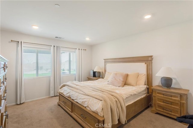 bedroom featuring baseboards, visible vents, light colored carpet, and recessed lighting