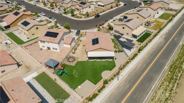 birds eye view of property with a residential view