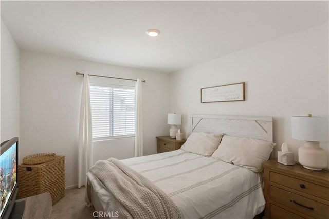 carpeted bedroom with baseboards