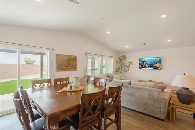 dining room with visible vents, recessed lighting, wood finished floors, and lofted ceiling