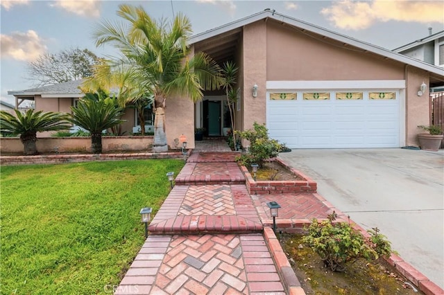 mid-century home with an attached garage, concrete driveway, a front lawn, and stucco siding