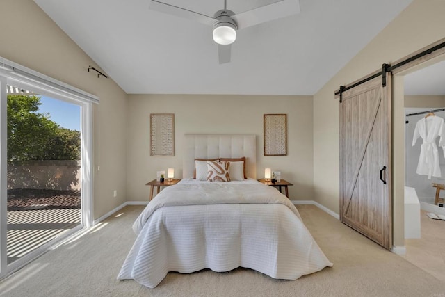 bedroom with a barn door, light carpet, access to exterior, baseboards, and lofted ceiling