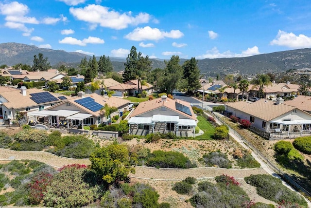 aerial view with a mountain view and a residential view