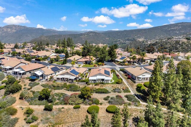birds eye view of property with a residential view and a mountain view