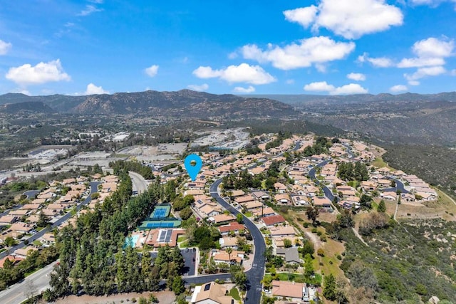 birds eye view of property with a mountain view and a residential view