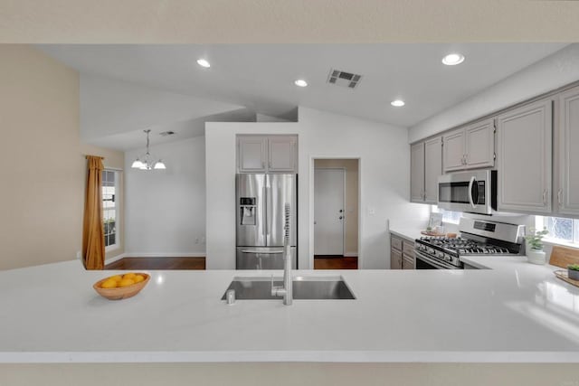 2487 Columbine Dr, Alpine, CA 91901 - kitchen with stainless steel appliances, lofted ceiling, gray cabinets, a chandelier, and recessed lighting