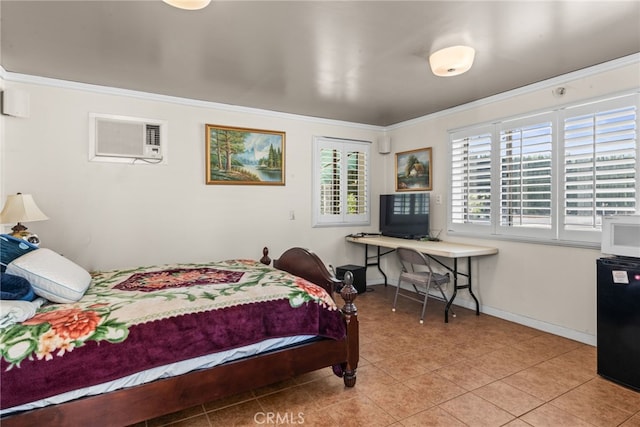 bedroom with an AC wall unit, crown molding, tile patterned floors, fridge, and baseboards