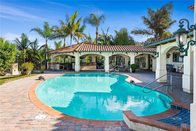 pool featuring a gazebo and a patio