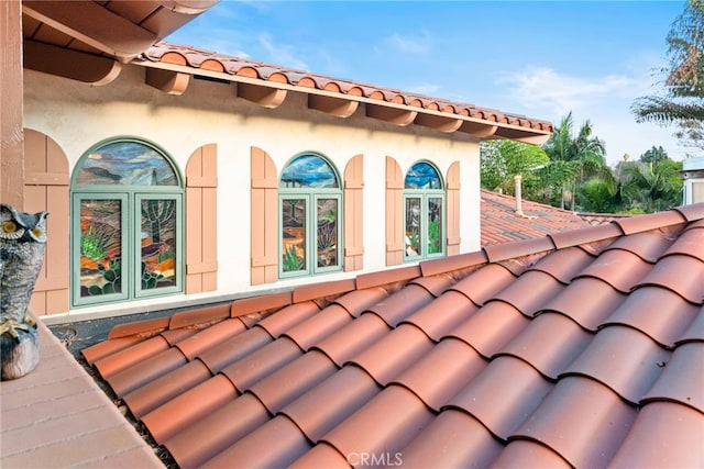 exterior details featuring a tiled roof