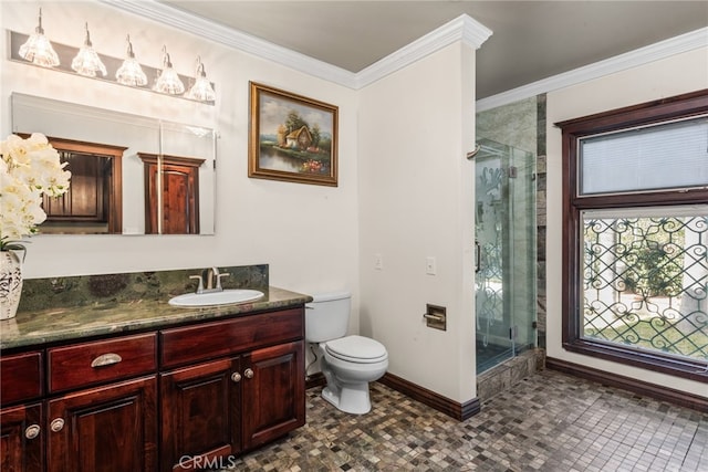 full bathroom with toilet, baseboards, vanity, and a stall shower