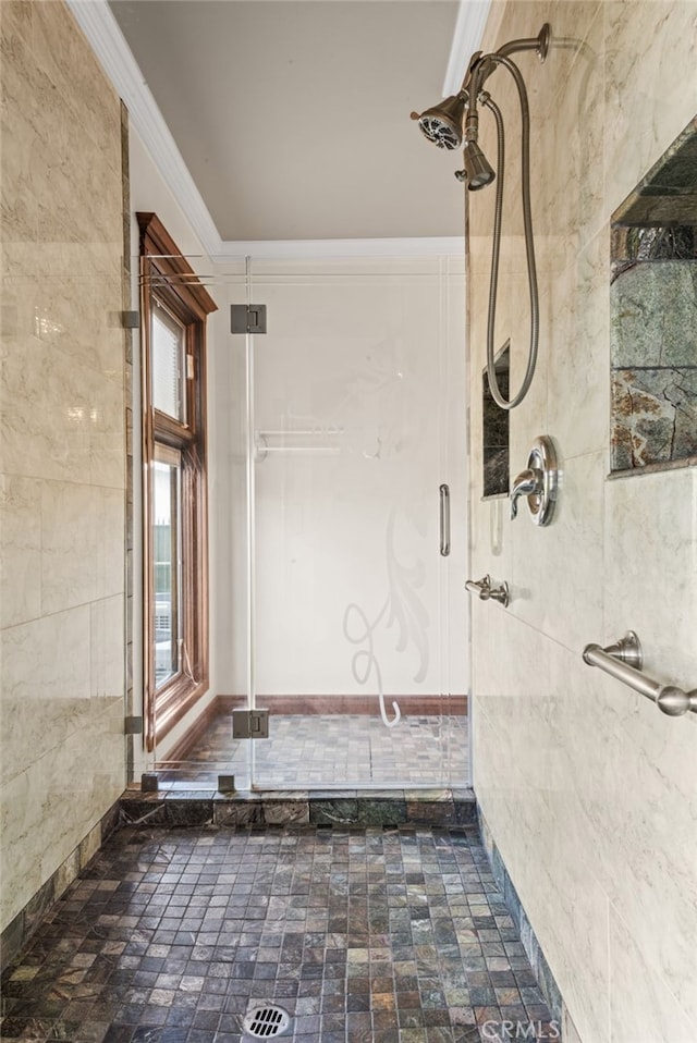 bathroom with a shower and ornamental molding