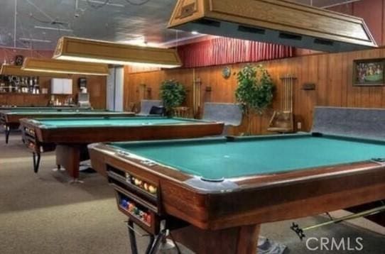 26221 Germantown Dr, Menifee, CA 92586 - playroom with billiards, wooden walls, and carpet floors