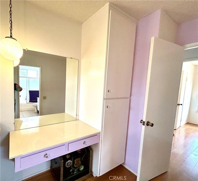 26221 Germantown Dr, Menifee, CA 92586 - bathroom featuring a textured ceiling and wood finished floors