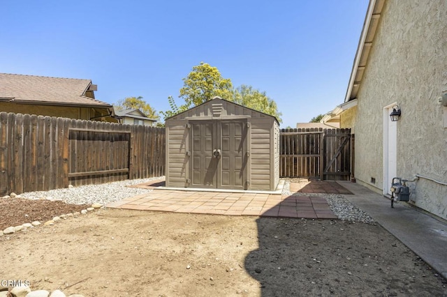 view of shed featuring a fenced backyard