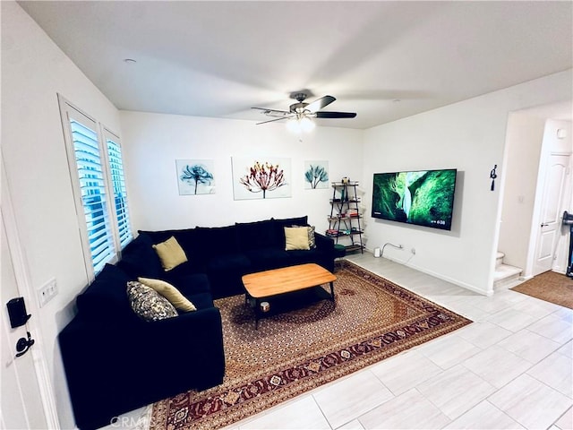 living room with a ceiling fan