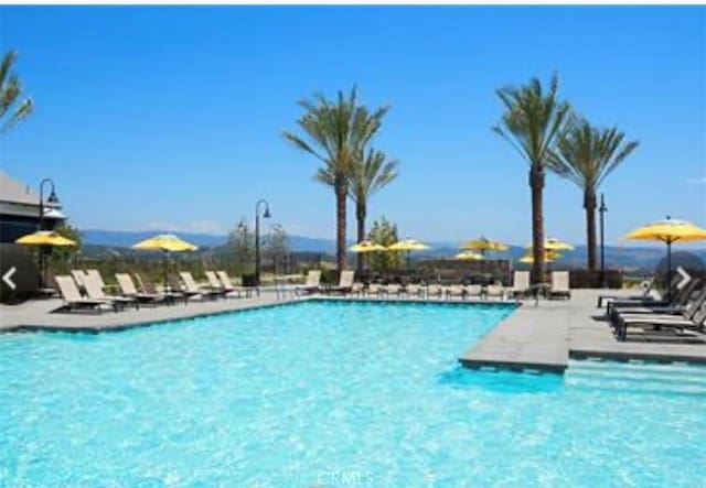 community pool featuring a patio area
