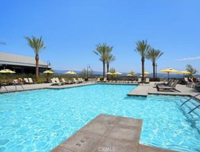 community pool featuring a patio