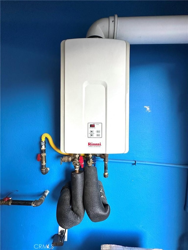 utility room with water heater
