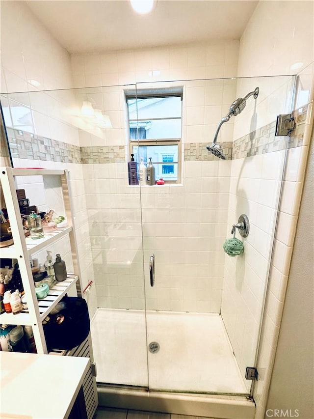 bathroom with a shower stall